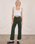 Madeline is 5'9" and wearing XXS Work Pants in Swamp Green paired with Cropped Tank Top in vintage tee off-white