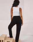 Back view of Rolled Cuff Sweat Pants in Basic Black and Cropped Tank in vintage tee off-white on Kandia