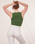 Back view of Tank Top in Dark Emerald Green and vintage off-white Western Pants on Allison