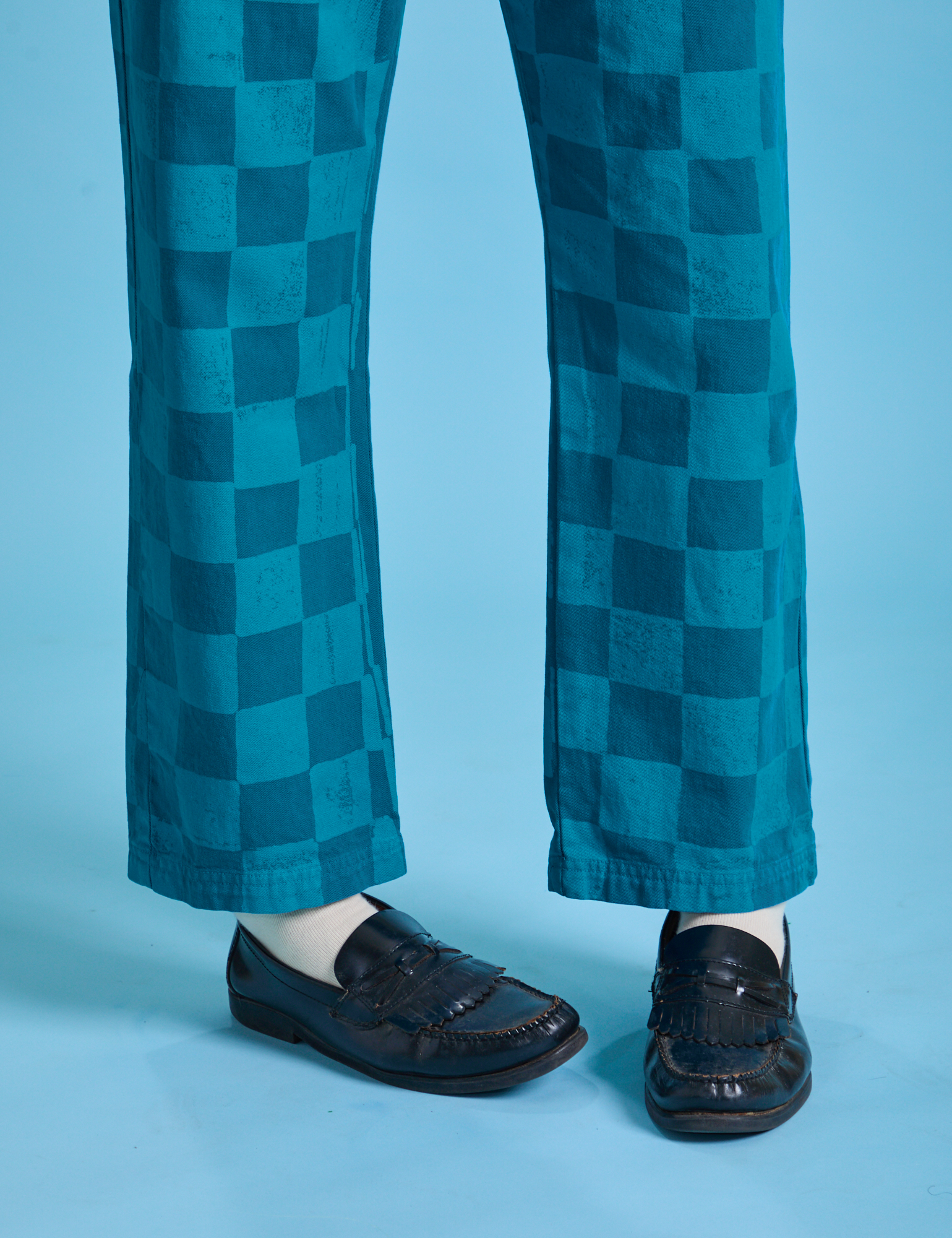 Checkerboard Work Pants in Blues pant leg close up on Quinn