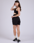 Pleated Trouser Shorts in Basic Black angled back view on Alex