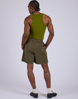 Back view of Pleated Trouser Shorts in Surplus Green and summer olive Racerback Tank on Jerrod