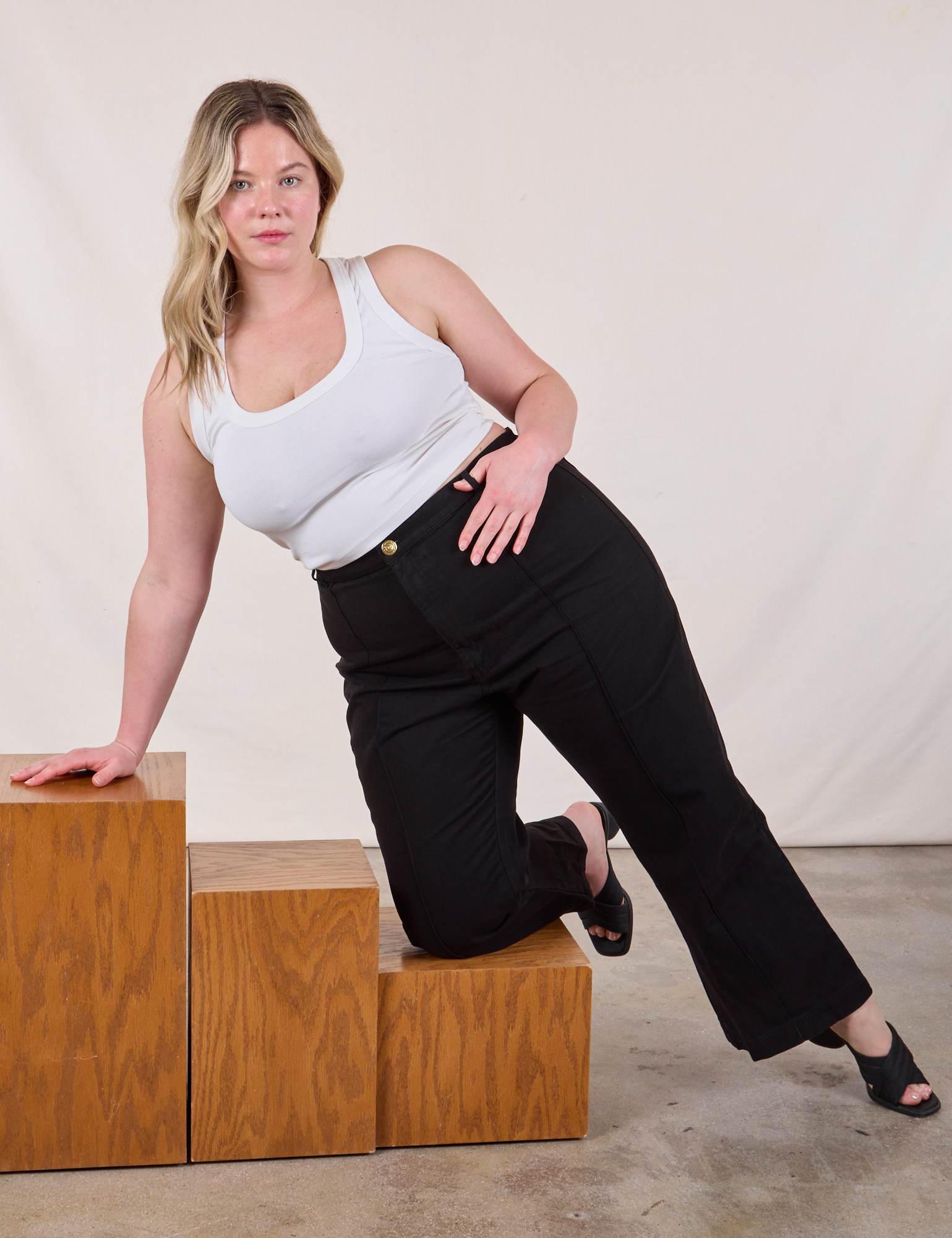Lish is wearing Western Pants in Basic Black and Cropped Tank in Vintage Tee Off-White