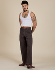 Angled front view of Work Pants in Espresso Brown and vintage tee white Cropped Tank on Jesse
