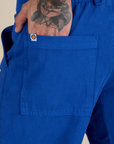 Close up of Jesse's hand in the back pocket of Work Pants in Royal Blue