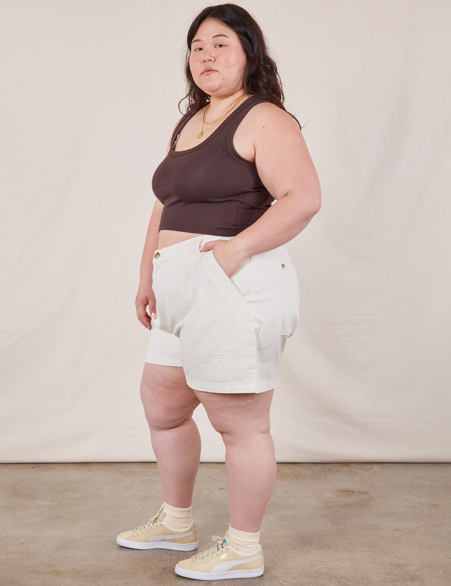 Side view of Classic Work Shorts in Vintage Tee Off-White and espresso brown Cropped Tank Top on Ashley