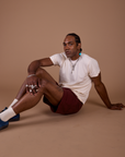 Jerrod is wearing an Organic Vintage Tee in Vintage Off White paired with Work Shorts in Red Wine