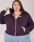 Marielena is wearing a zipped up Cropped Zip Hoodie in Nebula Purple