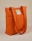 Angled view of Over-Shoulder Zip Mini Tote in Burnt Orange