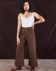 Jesse is wearing Overdyed Wide Leg Trousers in Brown and Cropped Cami in vintage tee off-white