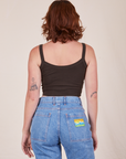 Back view of Cropped Cami in Espresso Brown and light wash Frontier Jeans worn by Alex