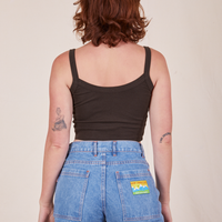 Back view of Cropped Cami in Espresso Brown and light wash Frontier Jeans worn by Alex