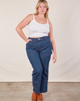 Lish is wearing Cropped Cami in Vintage Tee Off-White and dark wash Carpenter Jeans