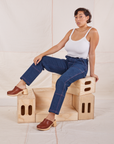 Tiara is wearing Carpenter Jeans in Dark Wash and Cropped Cami in vintage tee off-white