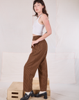 Side view of Checker Trousers in Brown & Black and Cropped Tank in vintage tee off-white