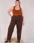 Lish is 5’8” and wearing L Overdyed Denim Trouser in Fudge paired with burnt terracotta Cropped Tank