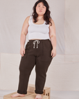 Ashley is 5'7" and wearing L Rolled Cuff Sweat Pants in Espresso Brown paired with Cropped Tank in vintage tee off-white