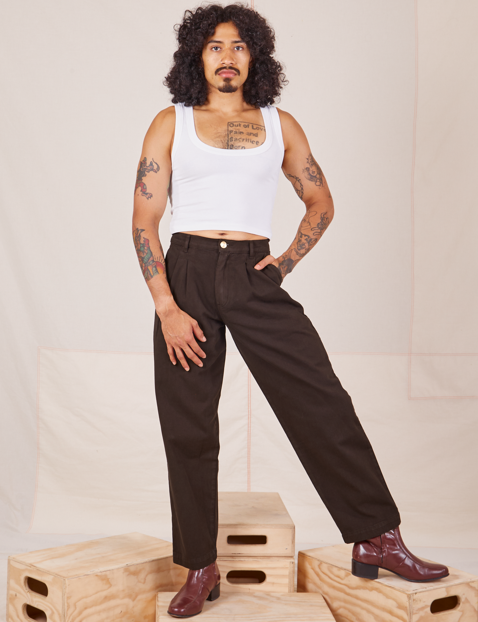 Jesse is 5&#39;8&quot; and wearing XXS Heavyweight Trousers in Espresso Brown paired with Cropped Tank Top in vintage tee off-white