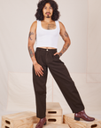 Jesse is 5'8" and wearing XXS Heavyweight Trousers in Espresso Brown paired with Cropped Tank Top in vintage tee off-white