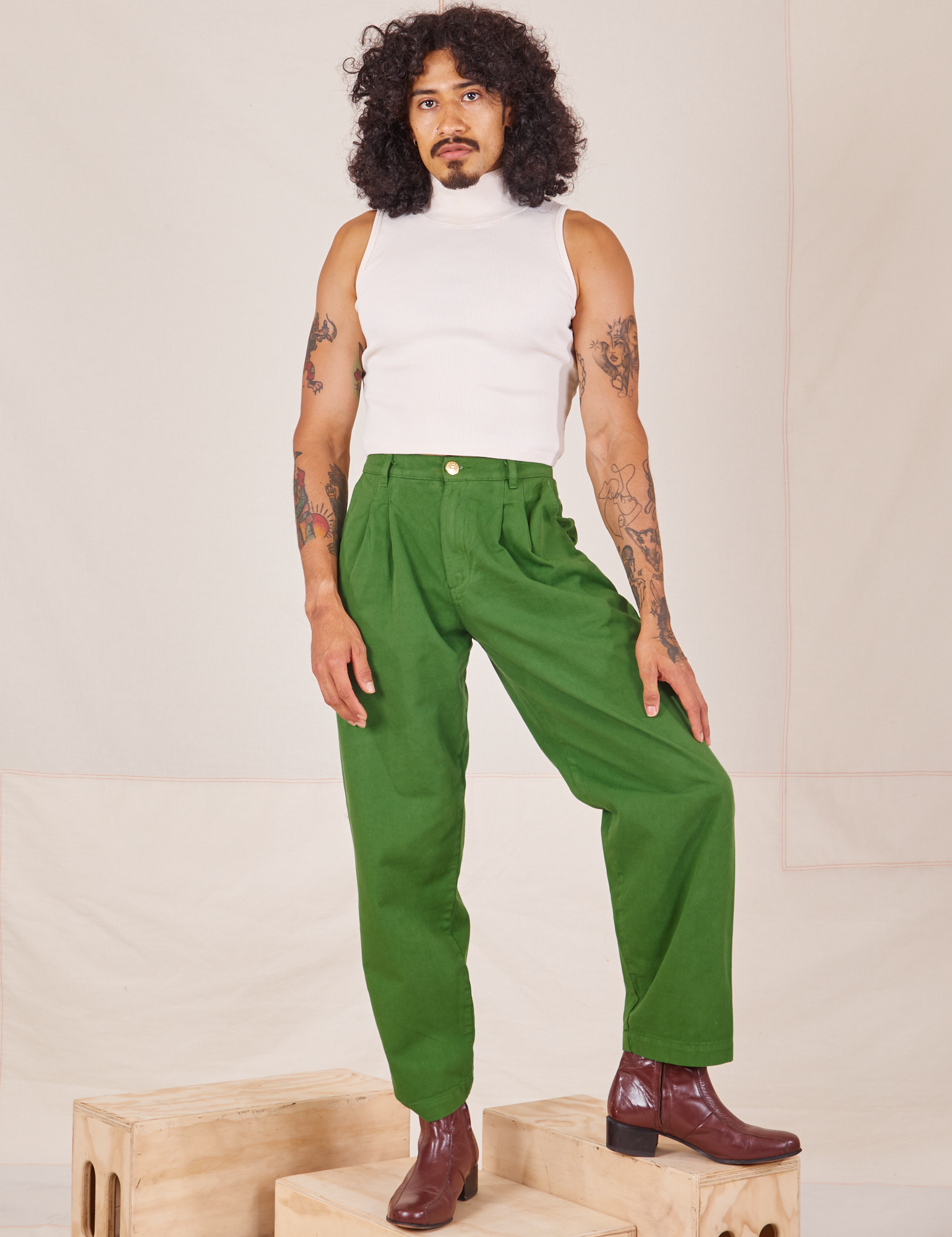 Jesse is 5&#39;8&quot; and wearing XXS Heavyweight Trousers in Lawn Green paired with vintage off-white Sleeveless Turtleneck