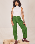 Jesse is 5'8" and wearing XXS Heavyweight Trousers in Lawn Green paired with Sleeveless Turtleneck in vintage tee off-white