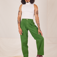 Jesse is 5'8" and wearing XXS Heavyweight Trousers in Lawn Green paired with vintage off-white Sleeveless Turtleneck