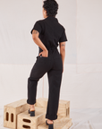 Heritage Short Sleeve Jumpsuit in Basic Black back view on Mika
