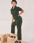 Heritage Short Sleeve Jumpsuit in Swamp Green side view on Mika