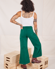 Back view of Bell Bottoms in Hunter Green and Cropped Cami in vintage tee off-white worn by Jesse