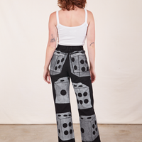 Back view of Icon Work Pants in Dice and vintage off-white Cropped Cami worn by Alex