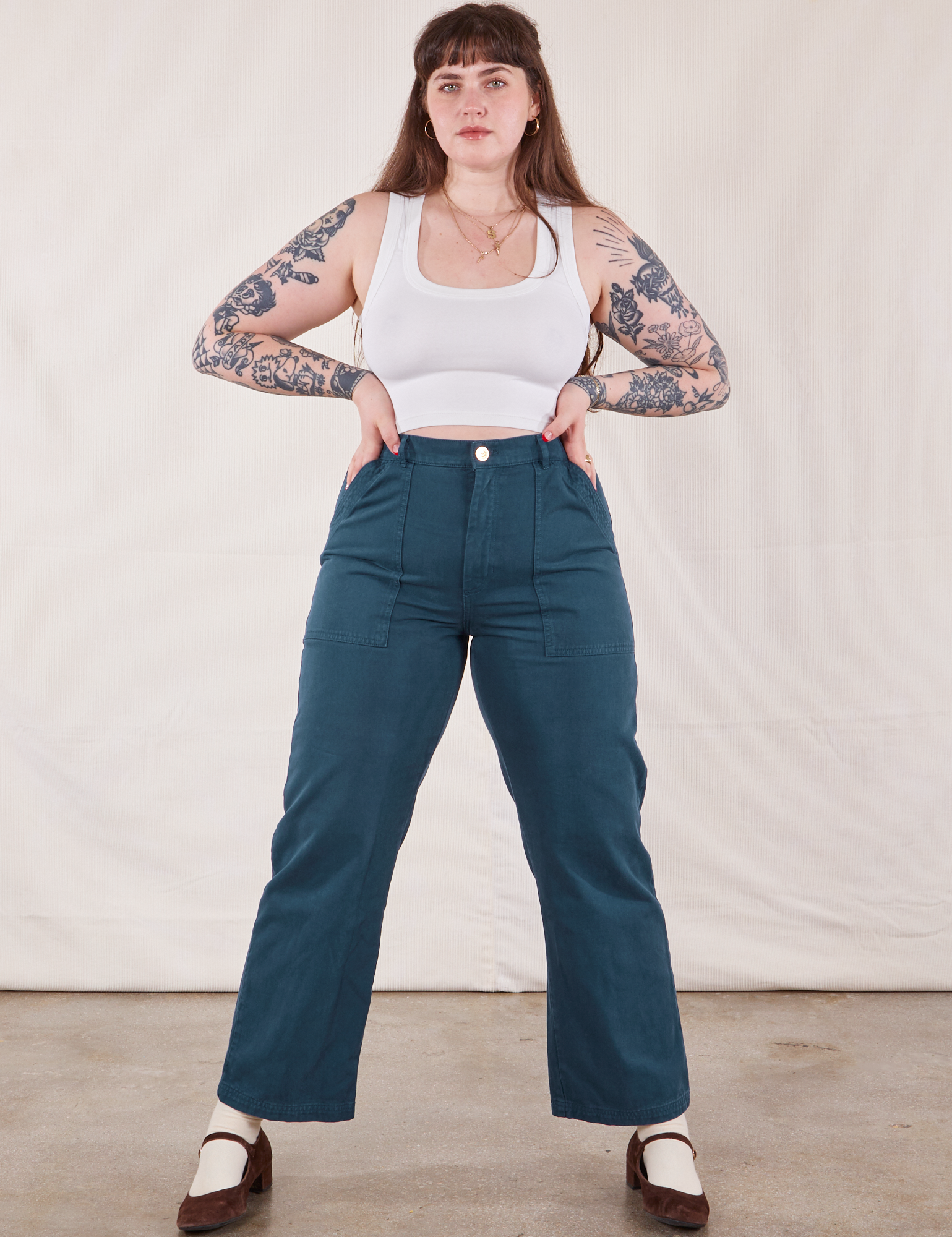 Sydney is 5'9" and wearing L Work Pants in Lagoon paired with vintage tee off-white Cropped Tank