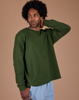 Angled front view of Long Sleeve Burly Tee in Evergreen on Jerrod