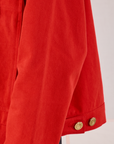 Mechanic Jacket in Mustang Red sleeve close up on Anthony