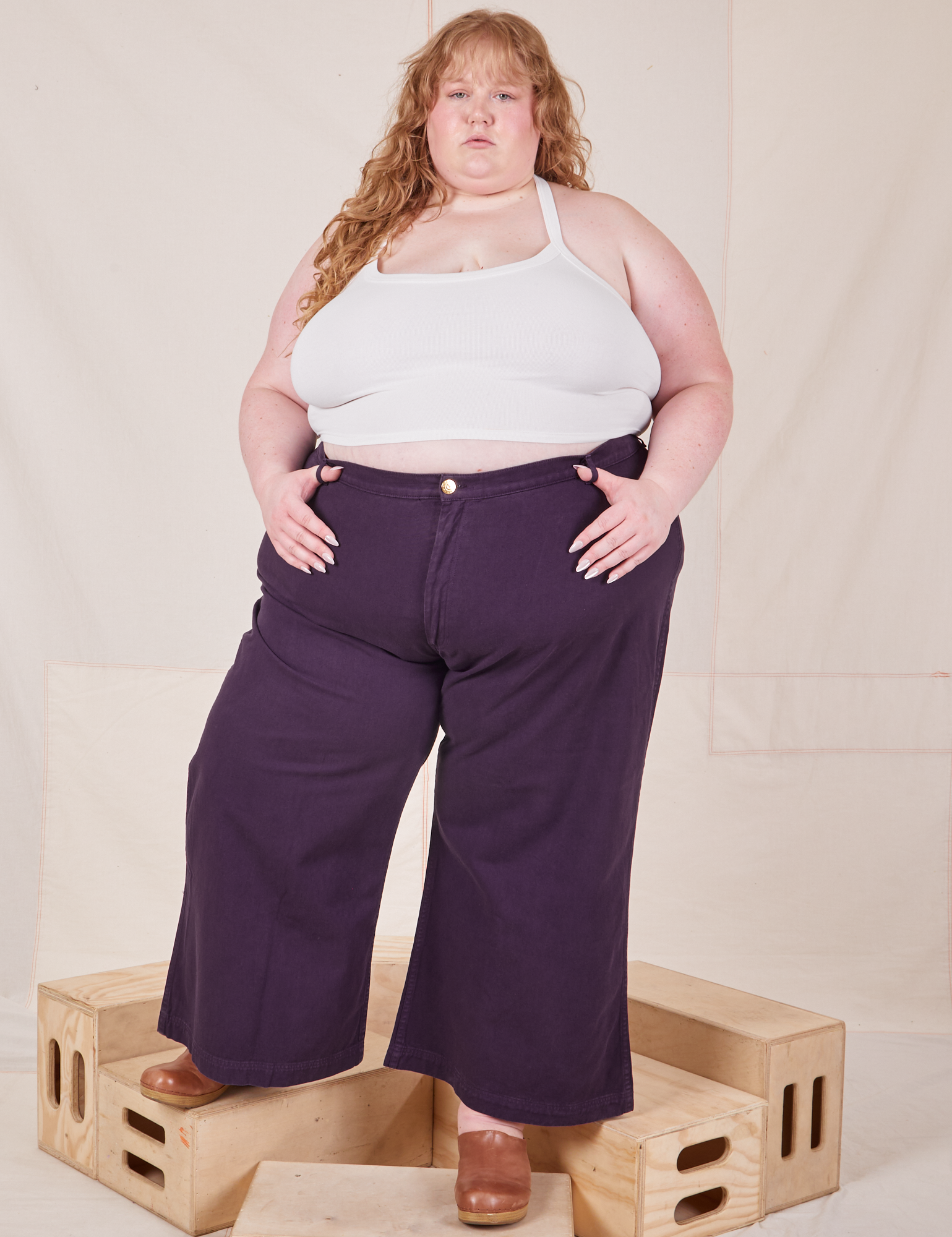 Catie is 5&#39;11&quot; and wearing 5XL Bell Bottoms in Nebula Purple paired with Halter Top in vintage tee off-white