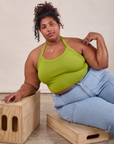 Morgan is wearing Halter Top in Gross Green