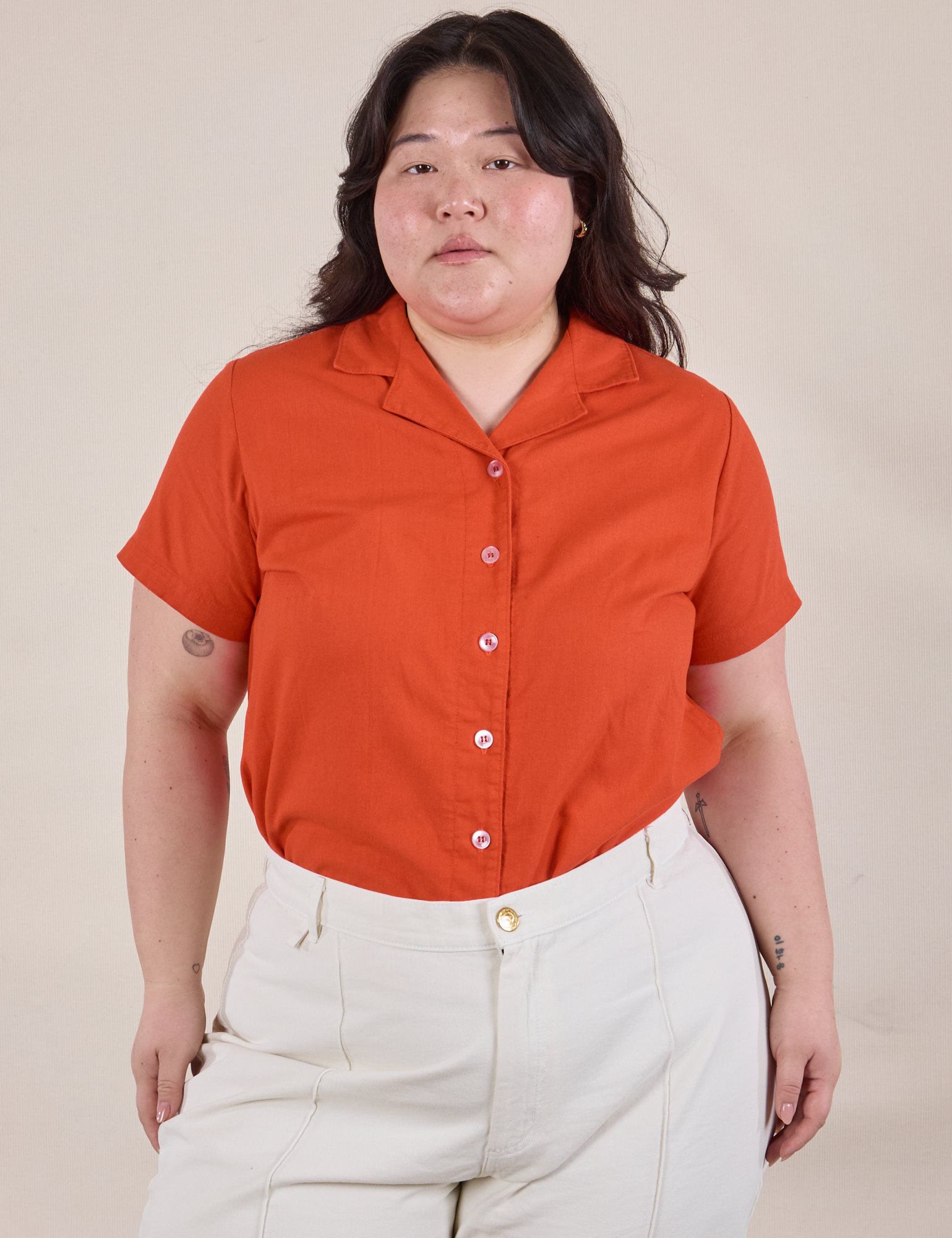 Ashley is wearing Pantry Button-Up in Chili Red tucked into vintage tee off-white Western Pants