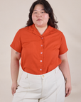 Ashley is wearing Pantry Button-Up in Chili Red tucked into vintage tee off-white Western Pants