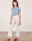 Alex is wearing Pantry Button-Up in Periwinkle tucked into vintage tee off-white Western Pants