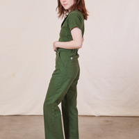 Petite Short Sleeve Jumpsuit in Dark Emerald Green side view on Hana
