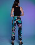 Back view of Work Pants in Rainbow Magic Waters and black Cropped Tank on Alex