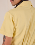 Short Sleeve Jumpsuit in Butter Yellow back shoulder close up on Anthony