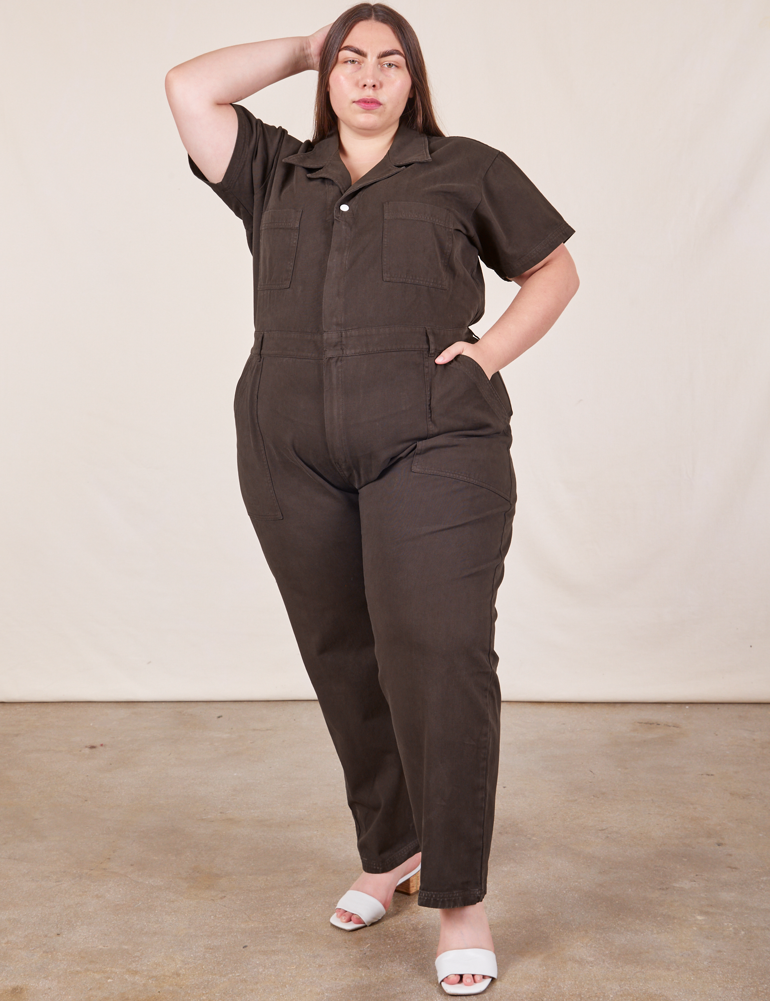 Marielena is 5’8” and wearing 2XL Short Sleeve Jumpsuit in Espresso Brown