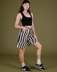 Angled front view of Longline Work Shorts in Natural and black Cropped Tank on Alex