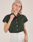 Madeline is wearing Pantry Button-Up in Swamp Green