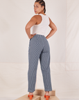 Back view of Denim Trouser Jeans in Railroad Stripe and vintage off-white Tank Top on Gabi