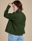 Angled back view of Denim Work Jacket in Evergreen on Hana
