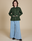Denim Work Jacket in Swamp Green and light wash Indigo Wide Leg Trousers on Hana