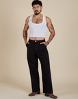 Jesse is 5’8” and wearing S Work Pants in Basic Black paired with vintage tee white Cropped Tank