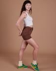 Side view of Classic Work Shorts in Fudgesicle Brown and Cropped Tank in Vintage Tee White on Alex