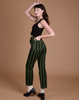 Angled back view of Black Stripe Work Pants in Evergreen on Alex